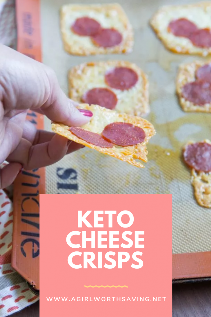 keto cheese crisps on a baking sheet with text overlay