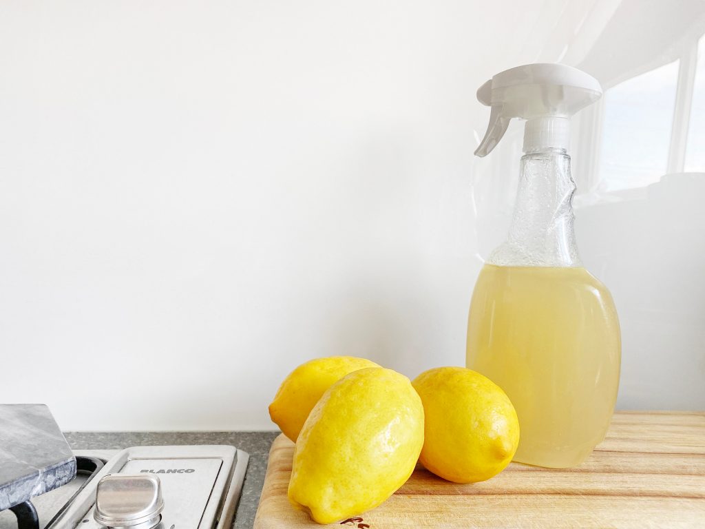 Natural cleaner made with lemons near a cook top
