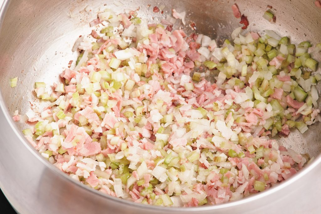 sautéed onions, celery and bacon in a large pot 