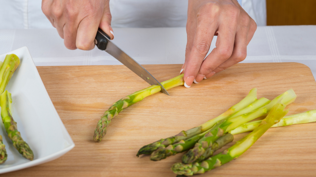 Woman cutting asparagus