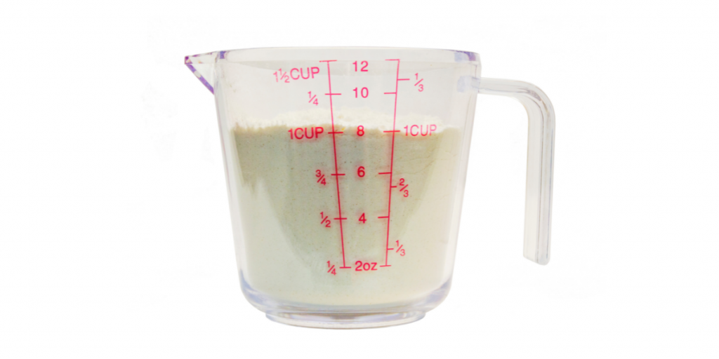 measuring cup with dry ingredients inside 