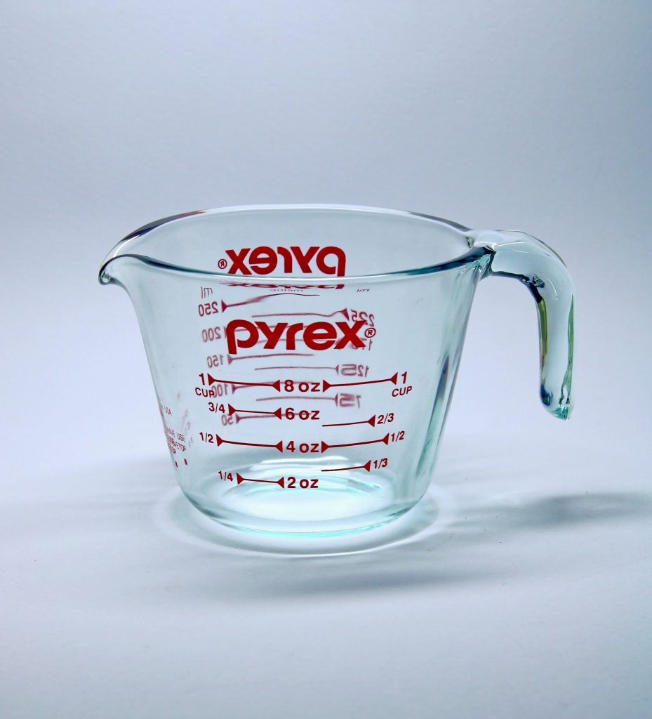Pyrex measuring cup on white background 