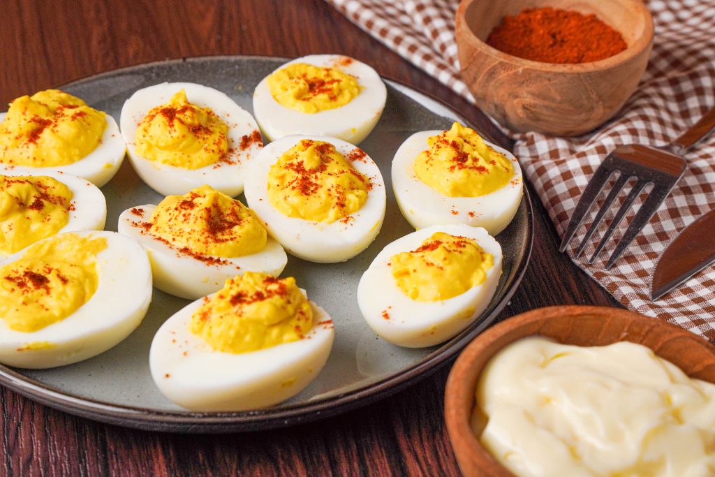 plate of keto deviled eggs with spices 