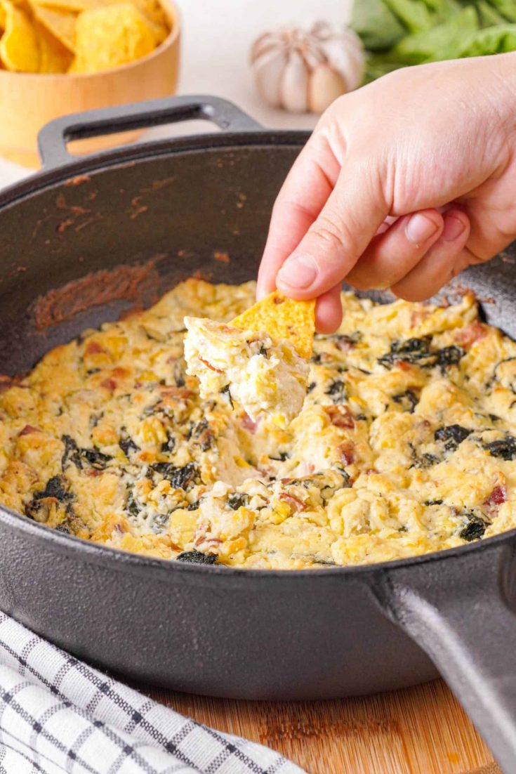 This Keto spinach artichoke dip is rich and creamy and a crowd-pleaser. Packed full of spinach, artichoke, rich cheeses and bacon, you will wow your tastebuds.