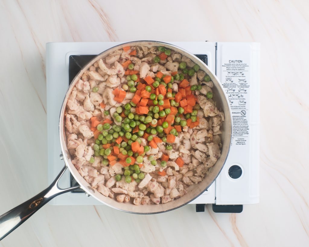 cooked chicken with peas and carrots 