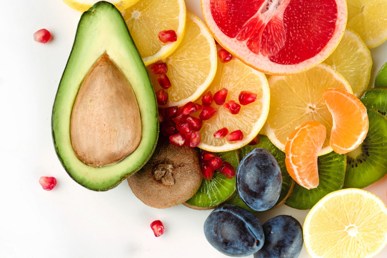 top view of slices fruits and avocado