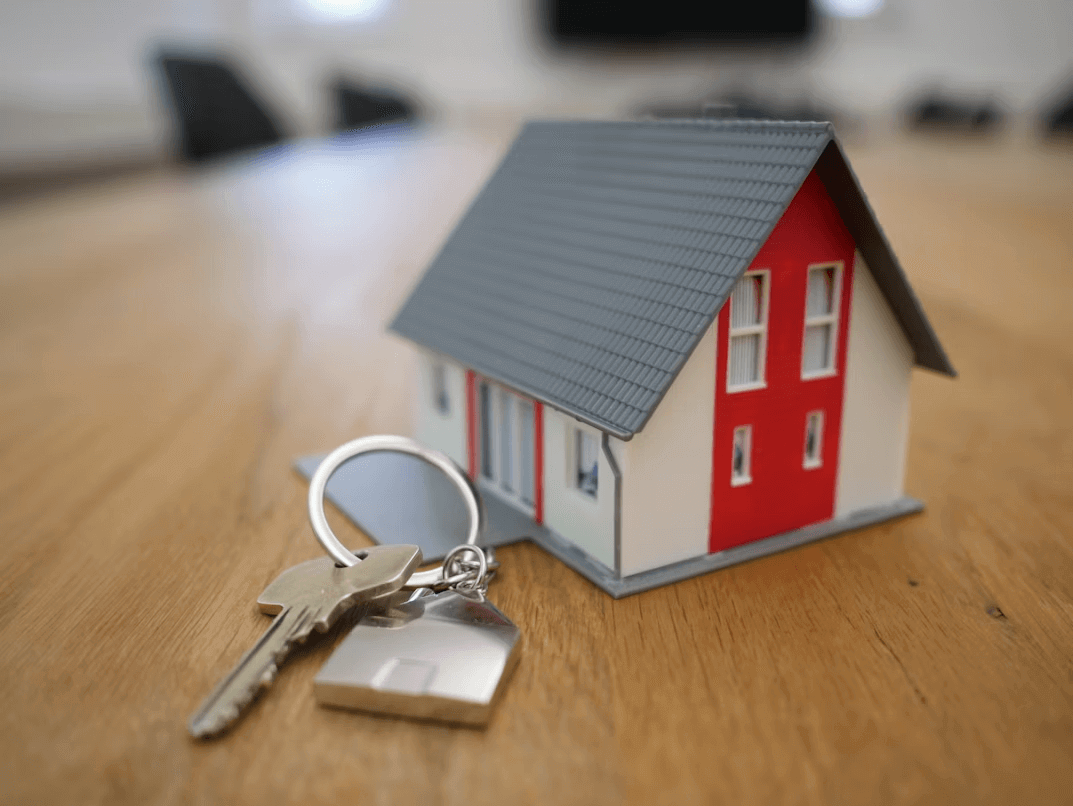 House model and key symbolizing asset division in divorce