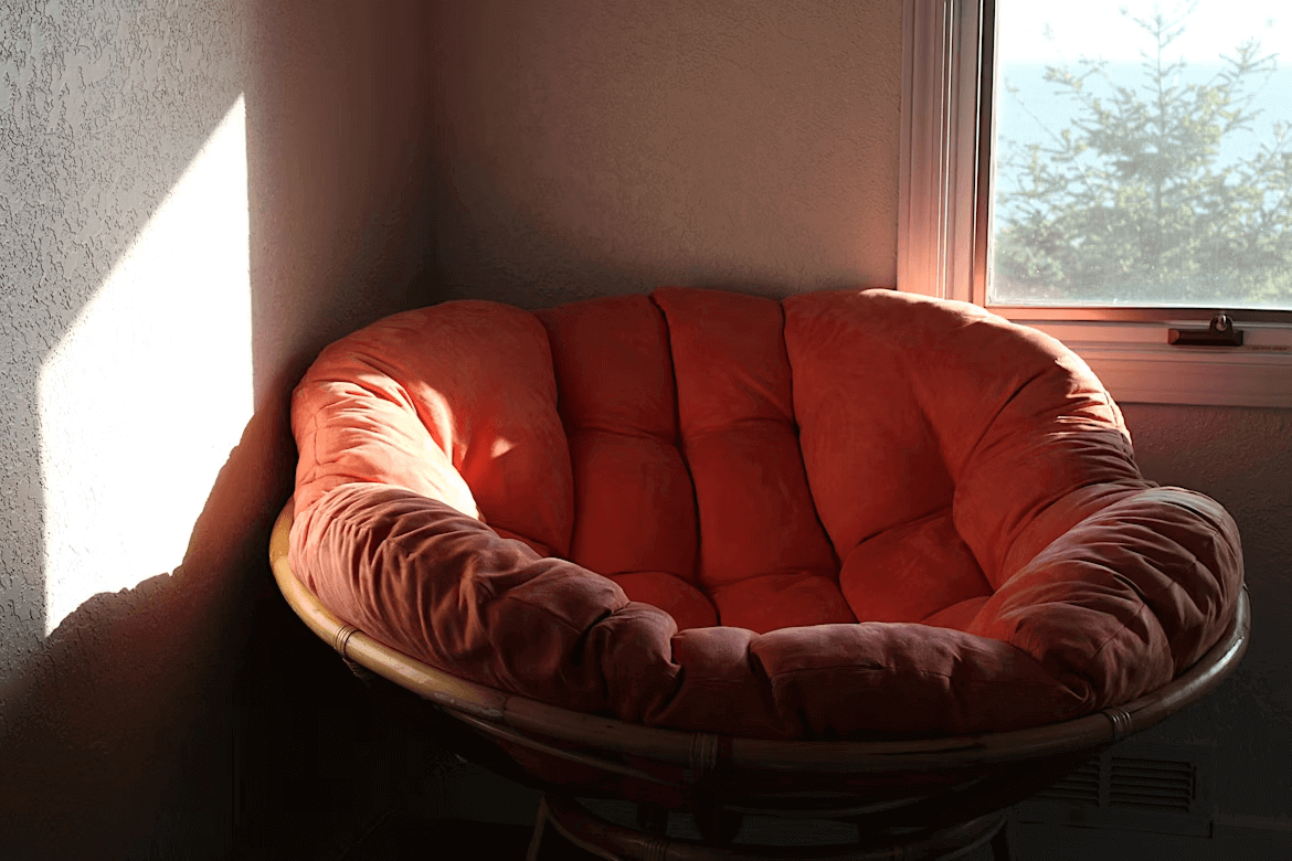 Comfortable chair by a window in a cozy room