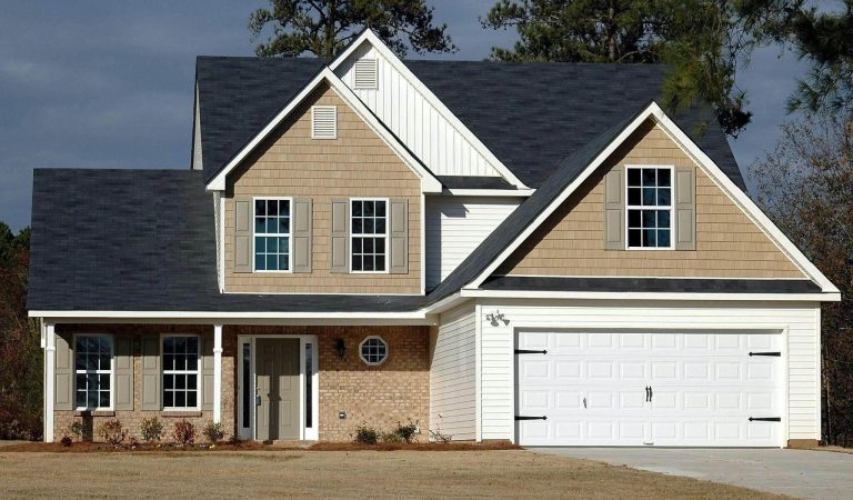 Two-story home with attached garage.