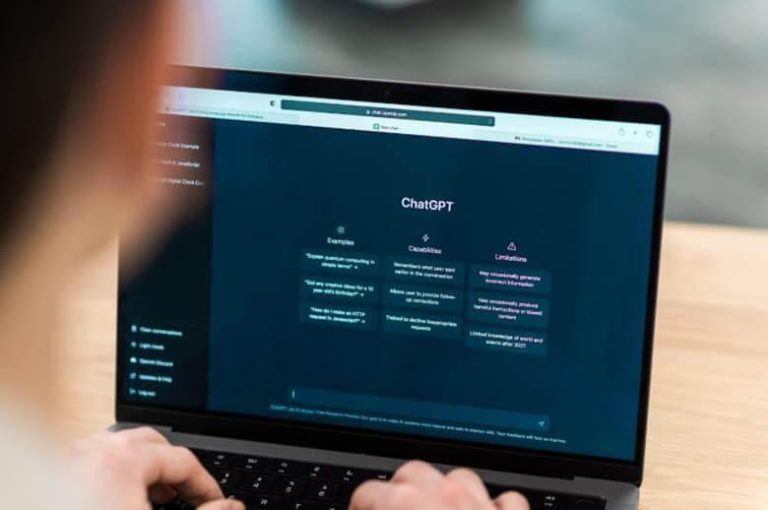 Person using laptop for AI essay detection