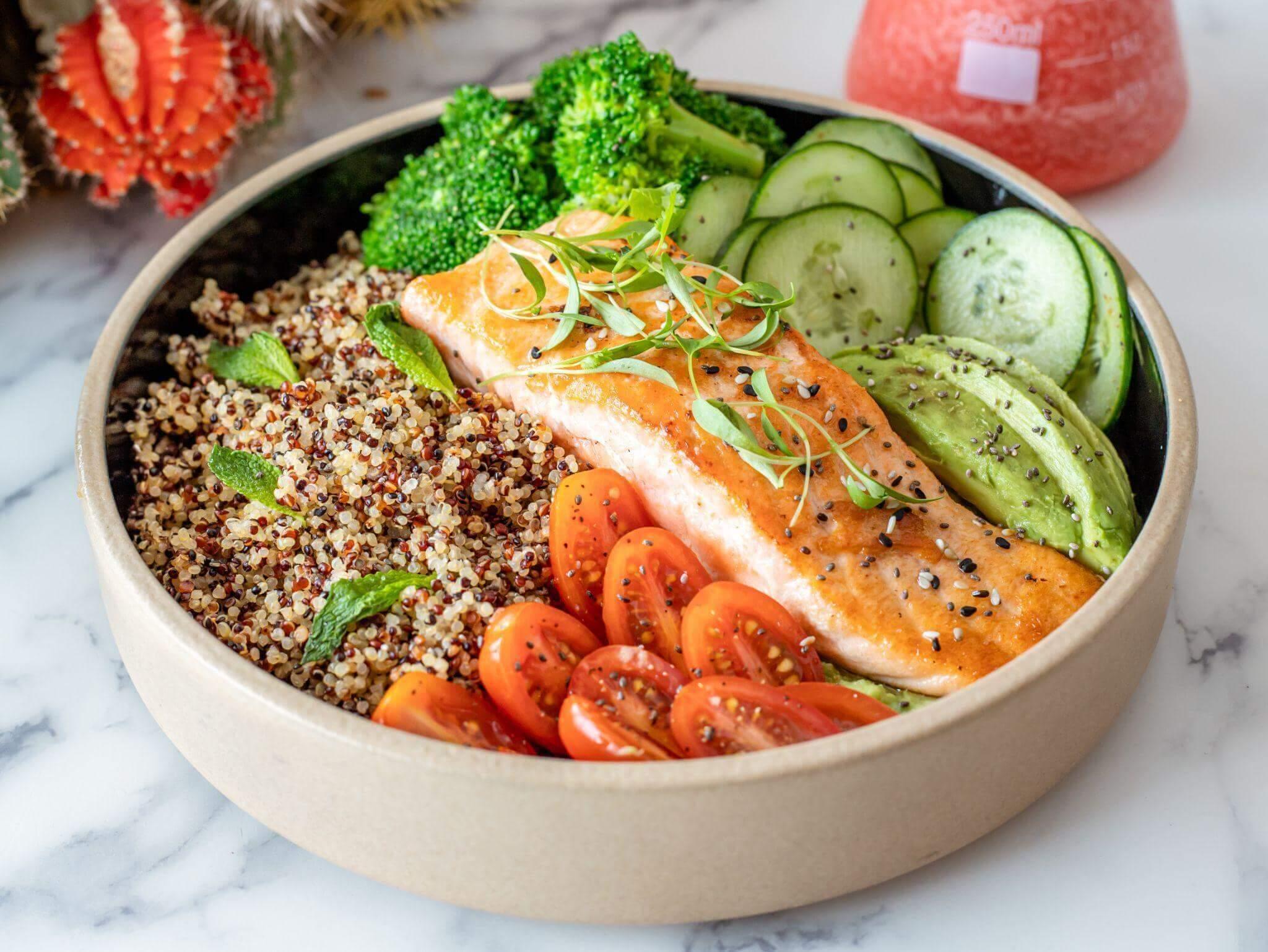 Healthy meal bowl with salmon, broccoli