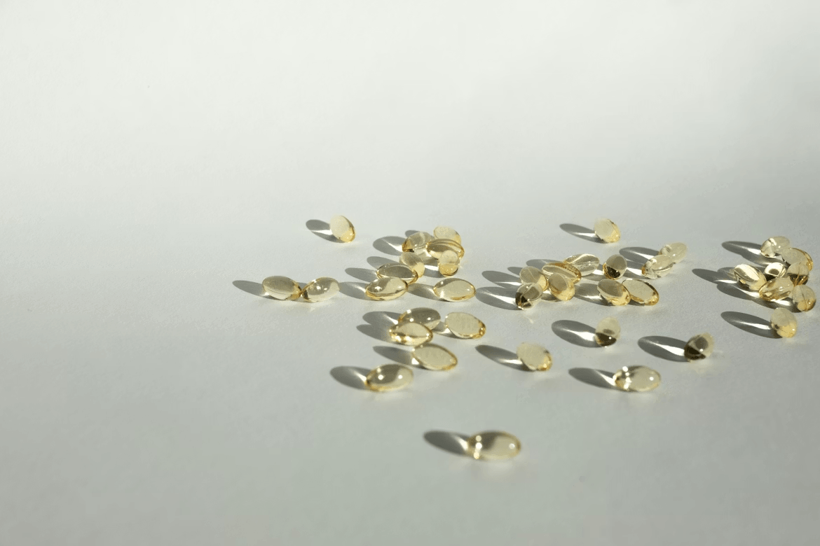 Small gold studs scattered on white surface