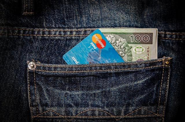 Credit card visibly sticking out of a person