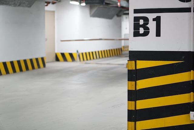 Empty parking garage with yellow and black stripes