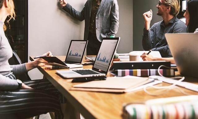 How to Reduce Administrative Errors When Updating Employee Pay Kelly Bejelly Group of employees working on laptops to reduce pay