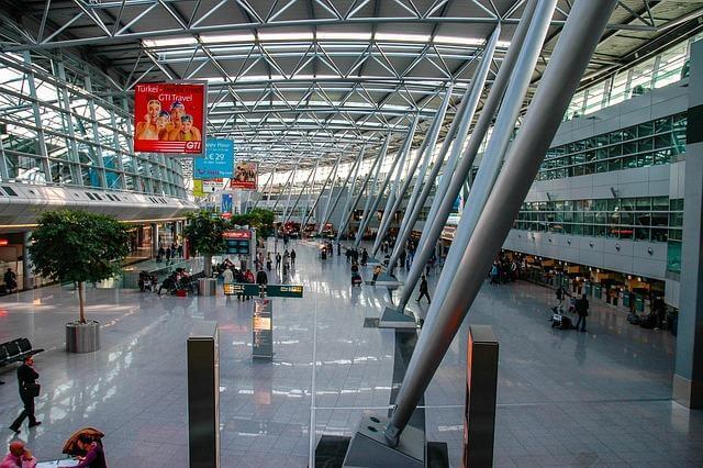 People inside a large building, potentially an airport