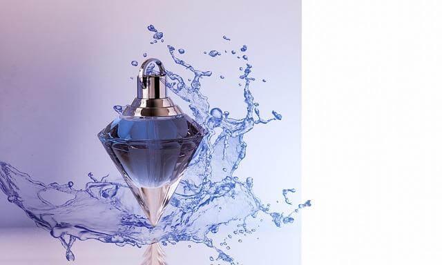 Perfume bottle with water splashes