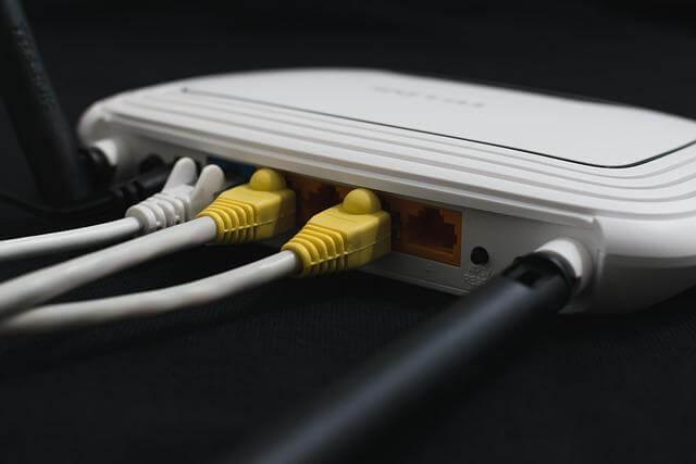 Router with yellow cables for home internet management