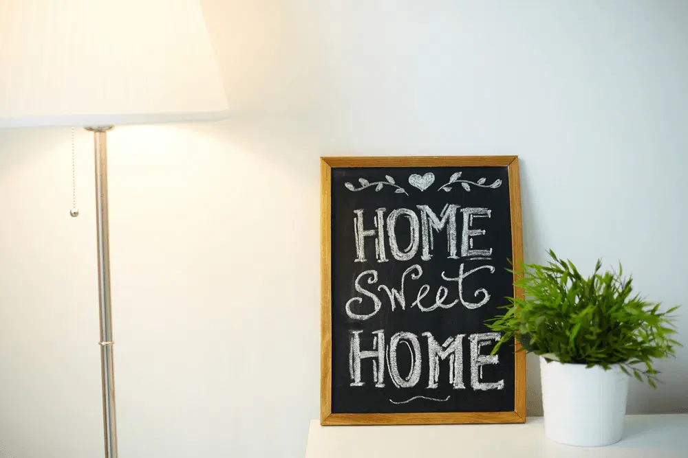 A chalkboard sign displaying 'Home Sweet