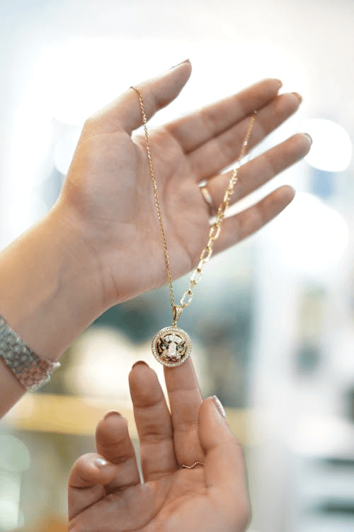 A pendant does that quietly. It sits at the center of your neckline and gently draws attention to your face.