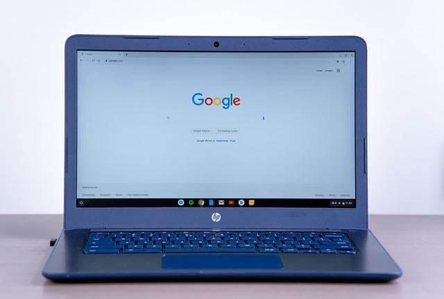 Laptop on a wooden desk, symbolizing modern SEO work