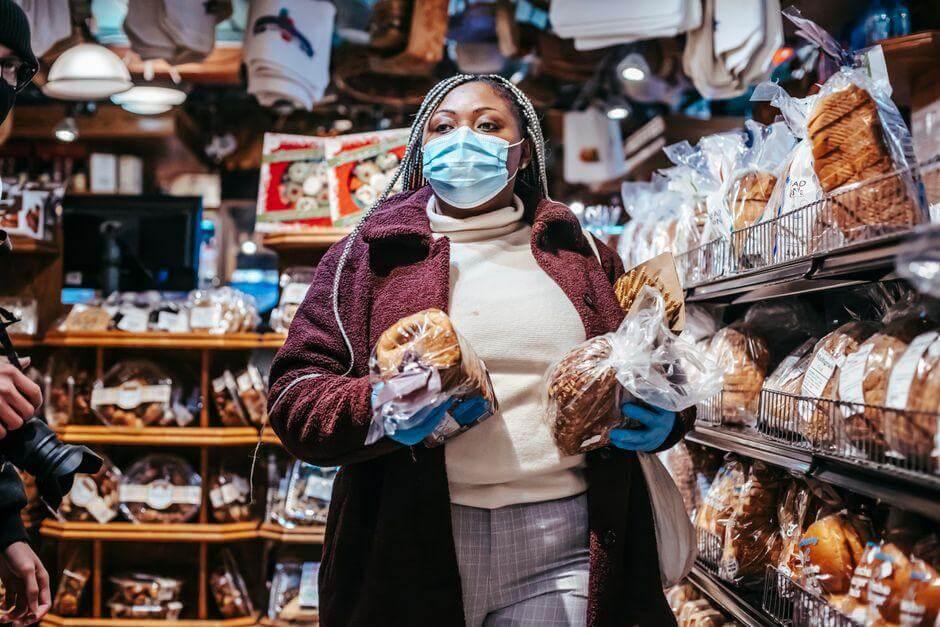 How to Read a Supplement Label Like You Read a Recipe Kelly Bejelly Woman in a face mask shopping in a bakery