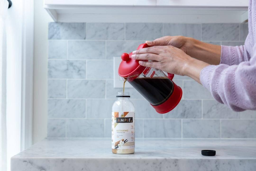 How to Read a Supplement Label Like You Read a Recipe Kelly Bejelly Woman pouring coffee into a cup, symbolizing