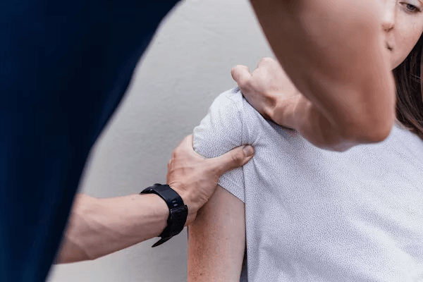 A woman getting her arm wrapped,