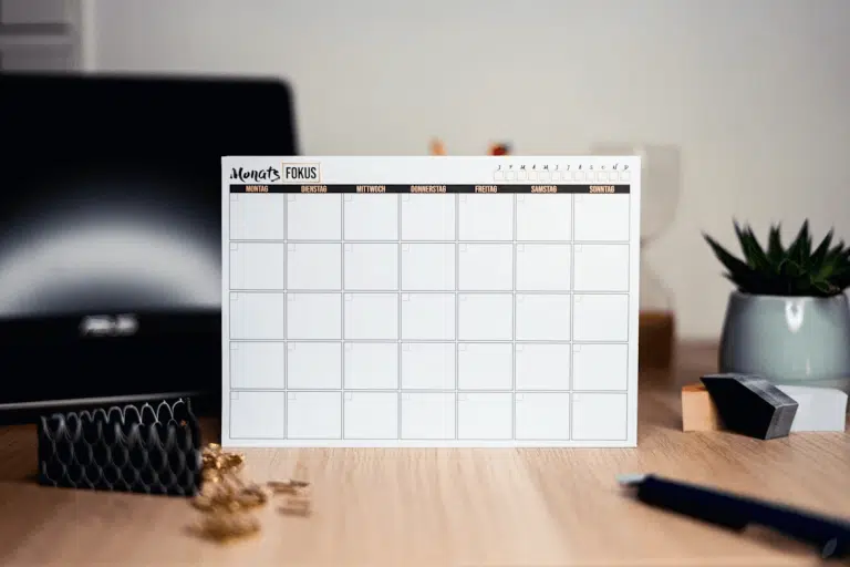 Desk with computer and calendar for printable projects