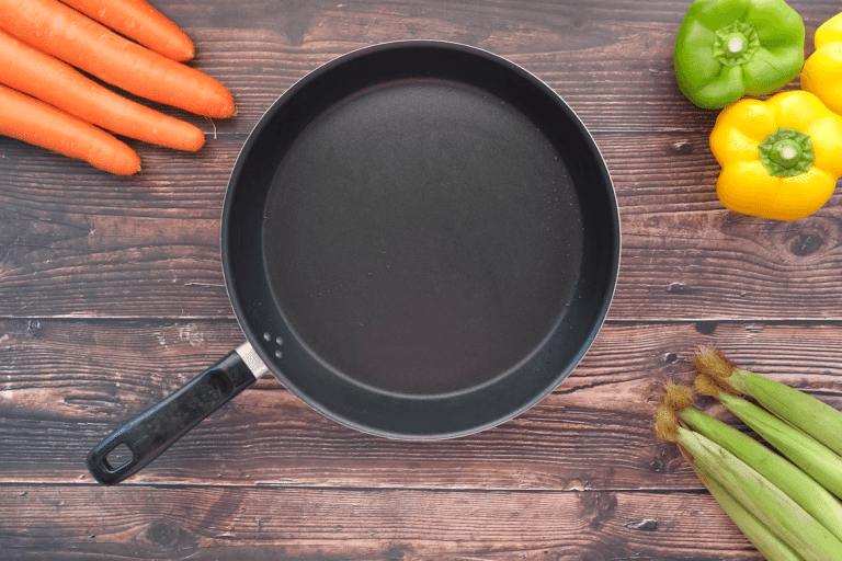 Frying pan on a wooden table next