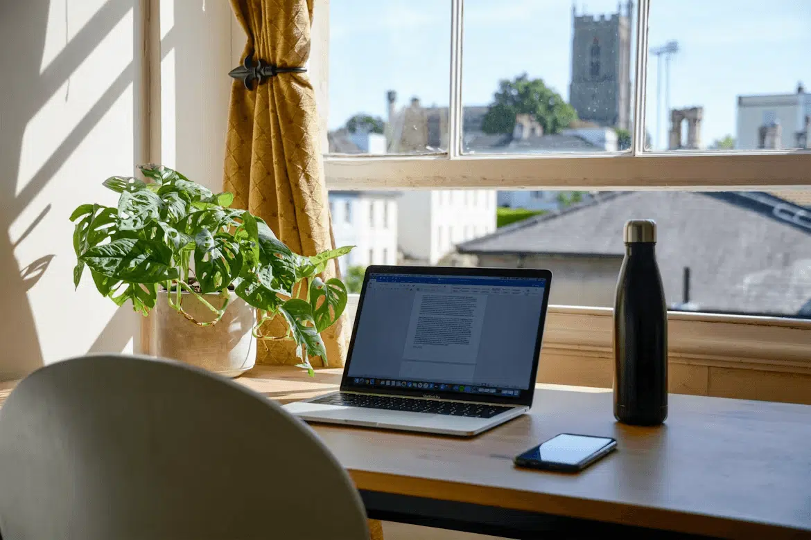 Why Home Personalization Is Becoming a Bigger Priority in Today's Era Kelly Bejelly Laptop on a wooden desk, symbolizing a personalized