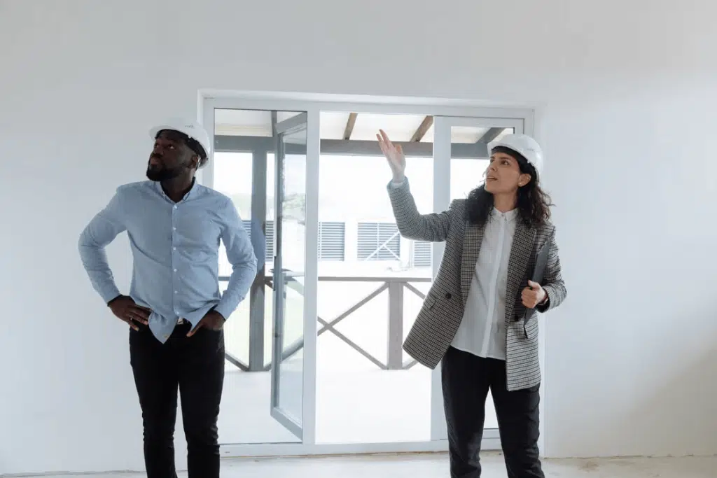 Man and woman embracing home personalization by standing