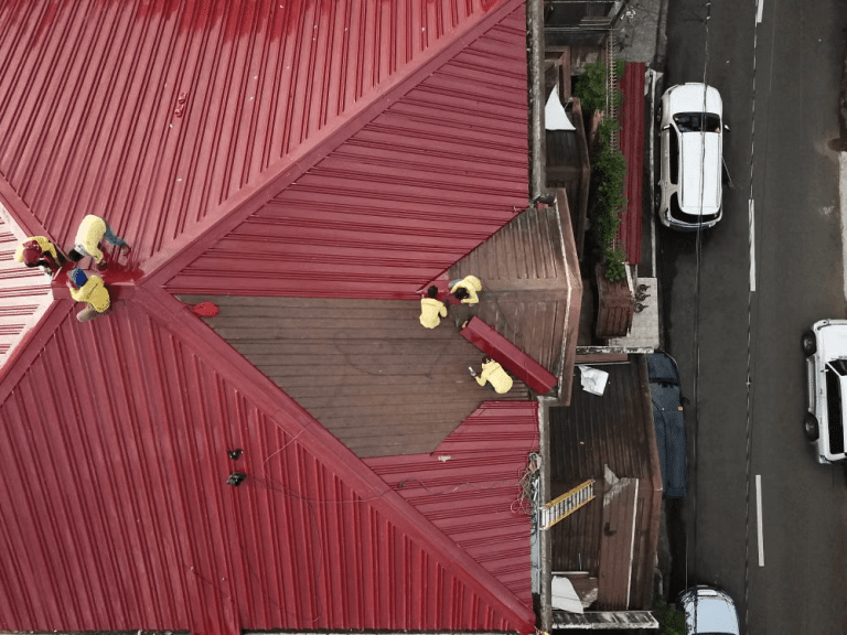 Overhead view of a red metal roof