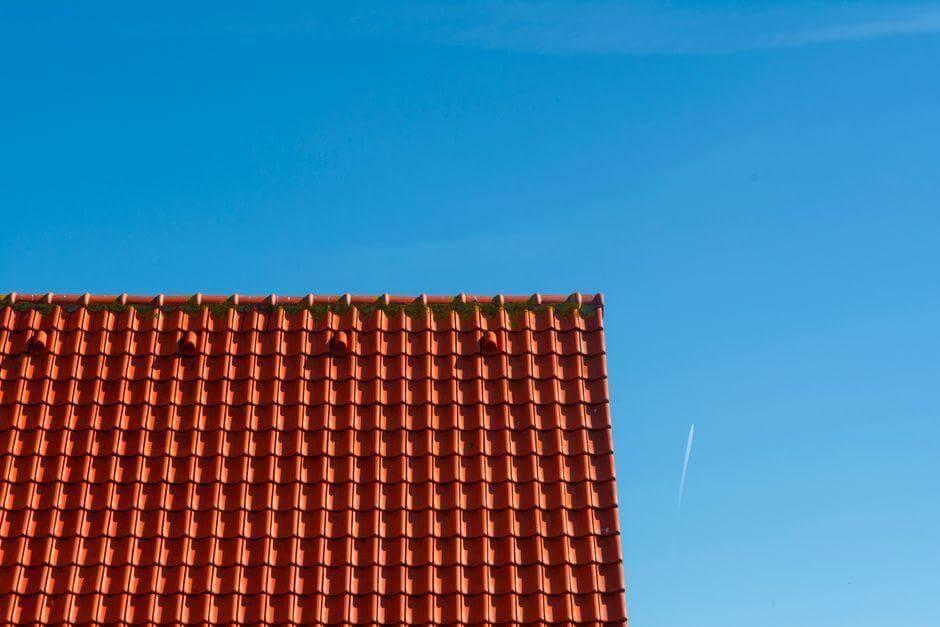 Red tiled roof under a clear blue sky