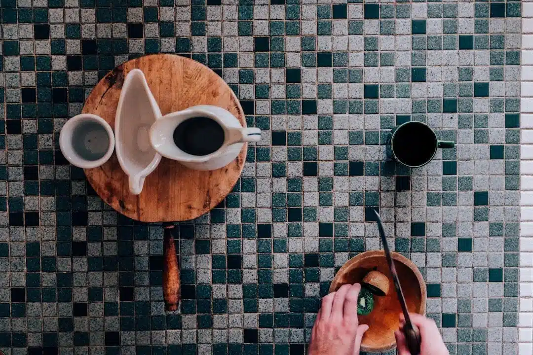 A home cook prepping ingredients in labeled bowls on a clean kitchen counter