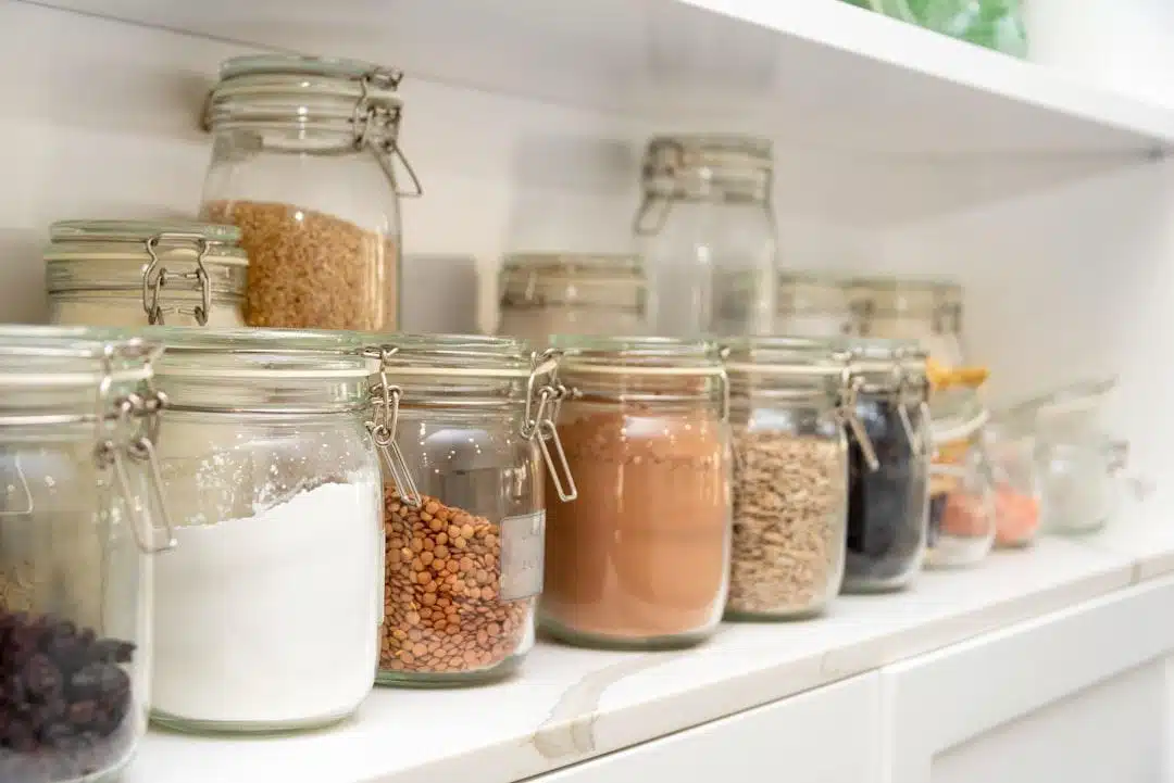 An organized pantry with neatly arranged jars and labeled containers