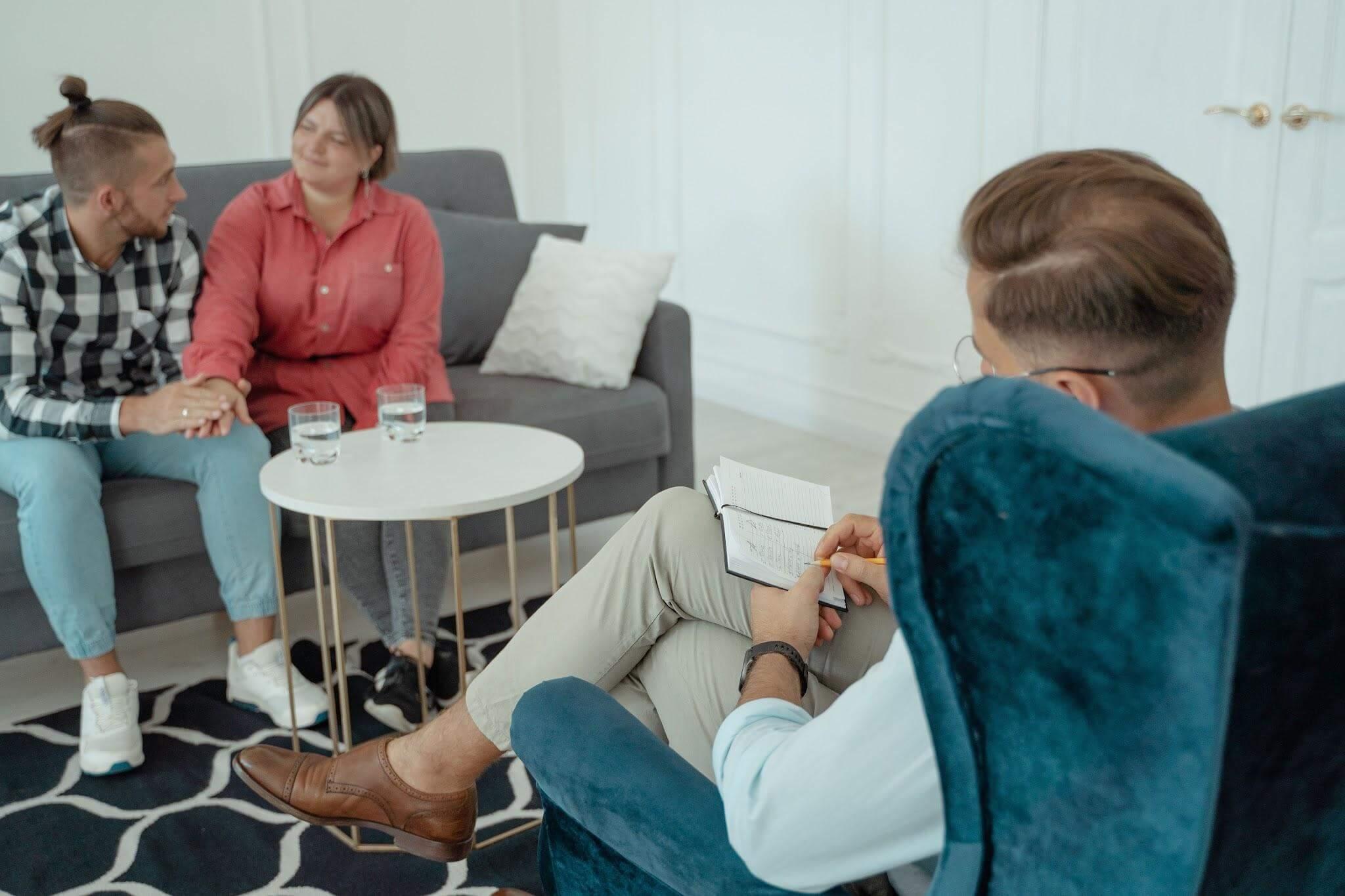 Couple speaking with a relationship counselor