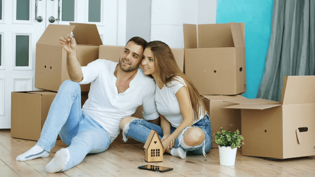 Man and woman sitting on the floor surrounded