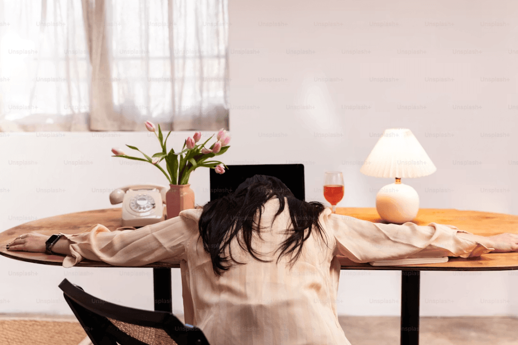 6 Signs It's Time to Pick Up a New Hobby Kelly Bejelly Woman with laptop at a table, perhaps considering a