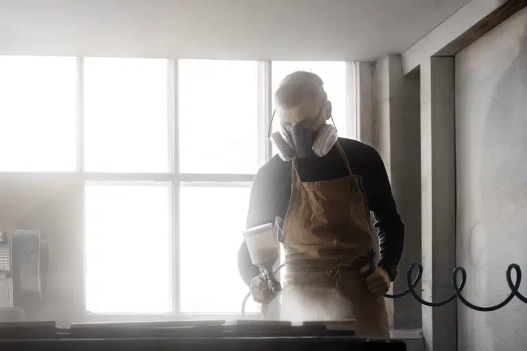 Man in apron and mask, representing an air duct