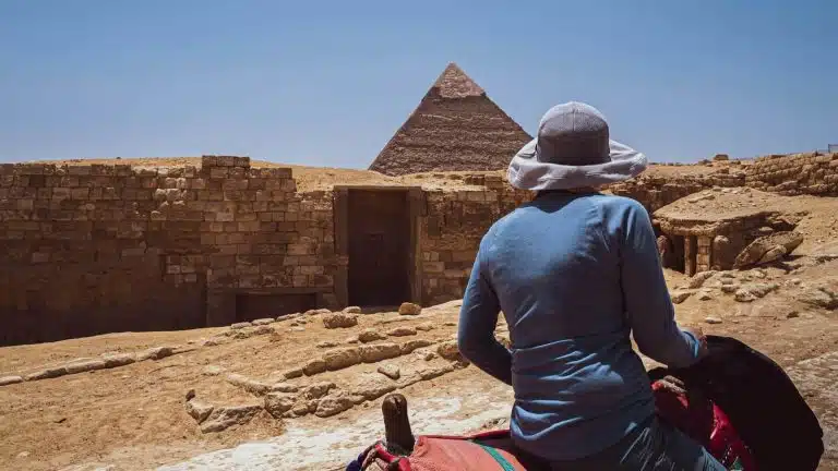 Woman on horseback experiencing cultural travel at the