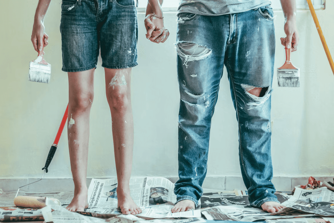 A man and a woman standing on a pile