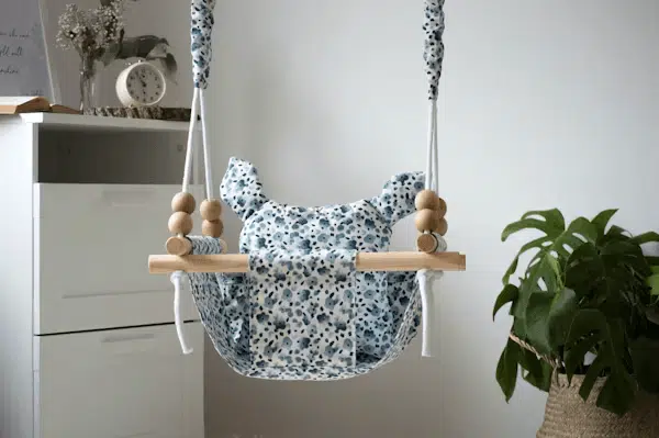 Blue and white floral print portable baby swing