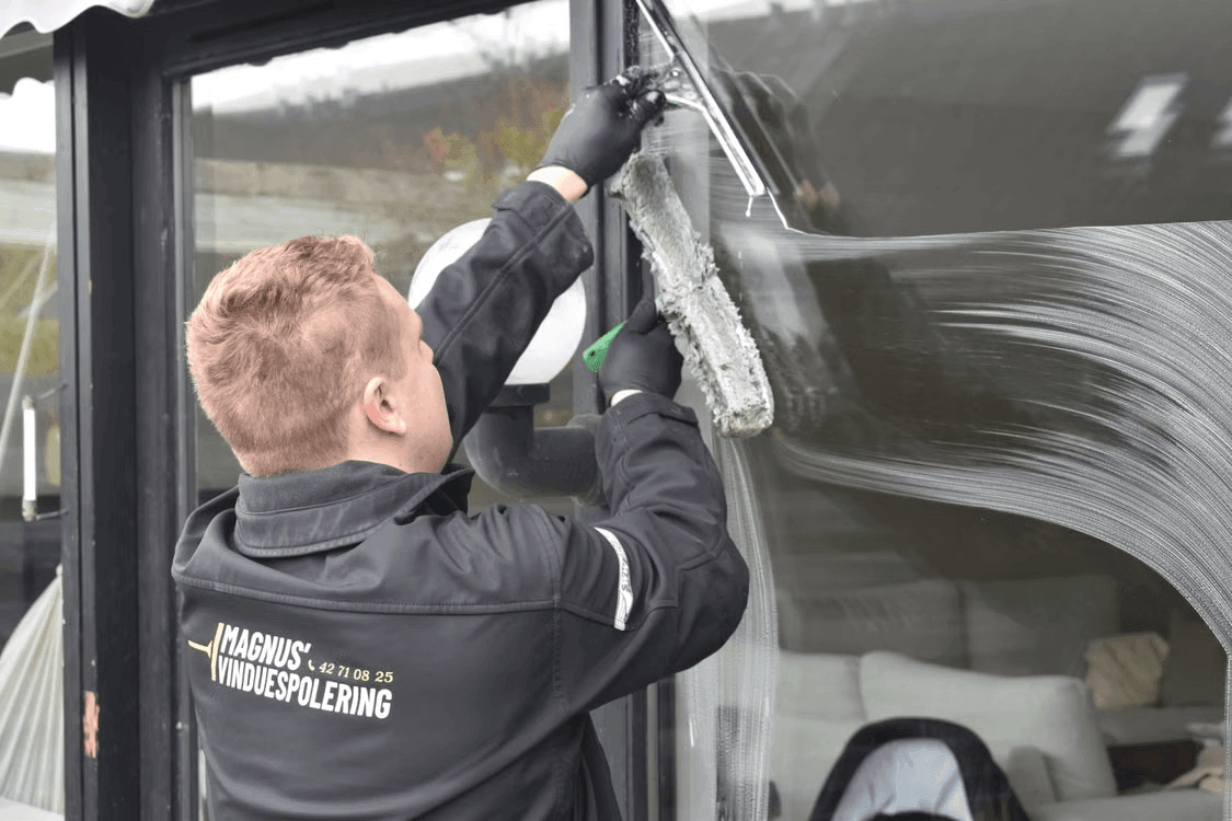 Man cleaning window for brighter home