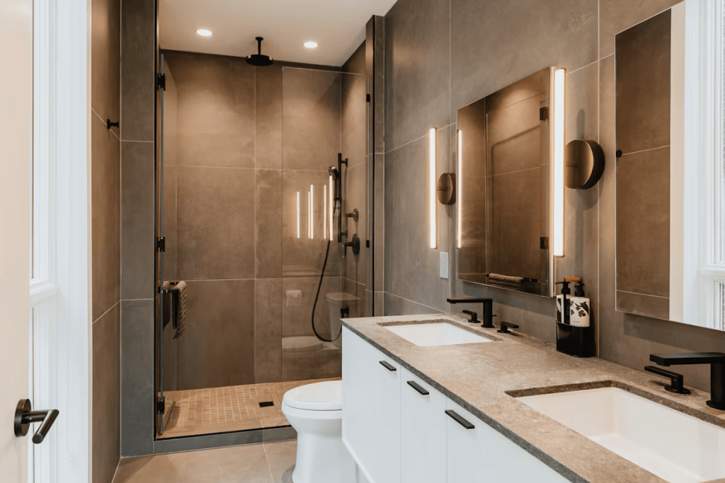 Modern bathroom with double sinks and shower