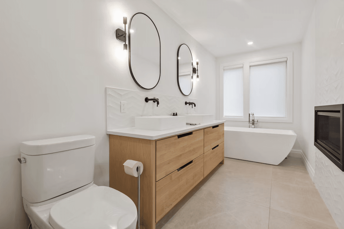 Modern bathroom with toilet, sink, and