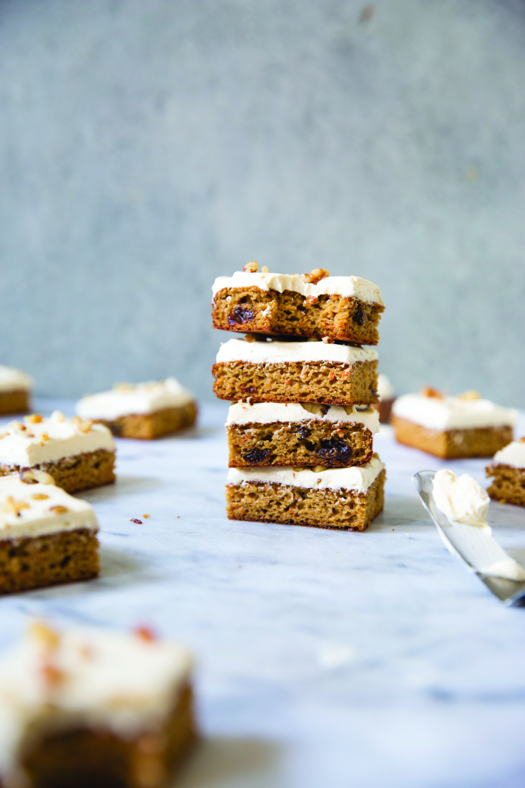 These healthy carrot cake bars make the perfect treat! Gluten-free and Paleo, you will love the warm comforting spice and the rich taste of fall in each bite.