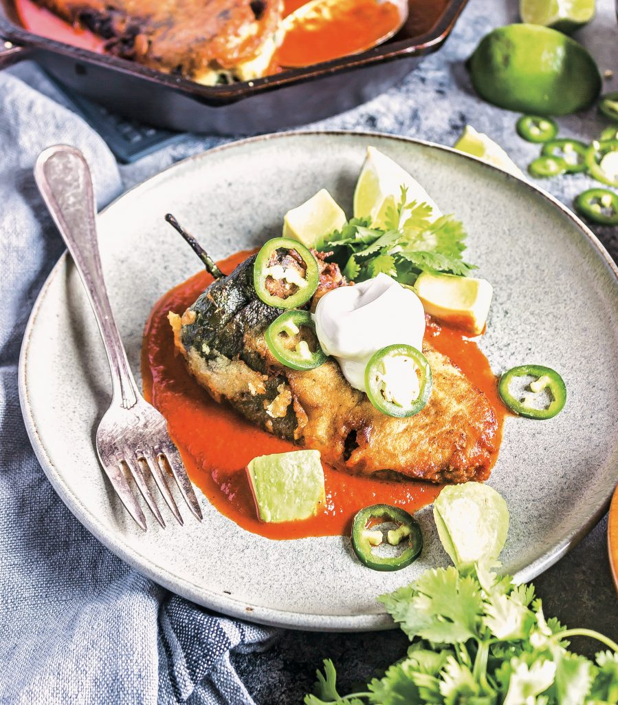 Keto Chile Rellenow on a plate with sauce 