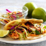 Spicy Tilapia Baja Tacos with Lime Slaw and Avocado Cilantro Sauce Kelly Bejelly A Mexican dish of Spicy Tilapia Baja Tacos with Lime Slaw and Avocado Cilantro Sauce