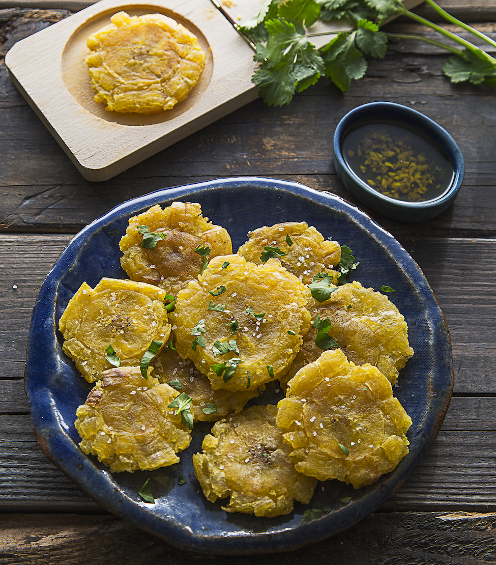 When I was pregnant with Bubba, I discovered the magic of Plantains.  Seriously, I had only thought of them as sweets but I soon learned I was very wrong.  My friend Amanda just released an amazing paleo cookbook filled with Latin American and I knew I had to share her Tostones/Patacones recipe.